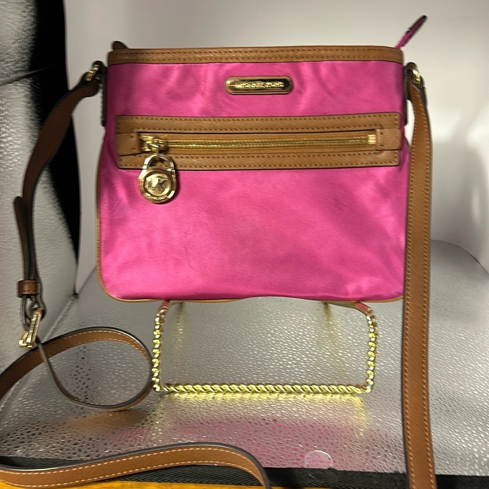 Michael Kors adorable Crossbody one call out a little spot on the back.​